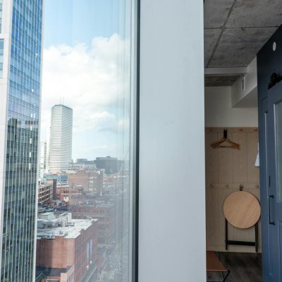 White Framed Glass Window With View of City Buildings